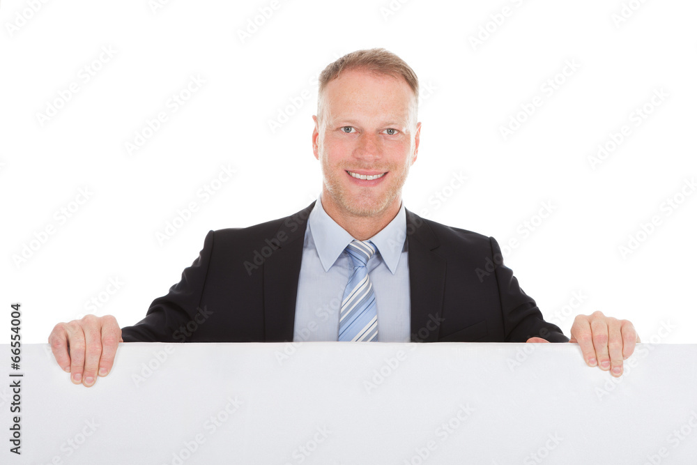 Confident Businessman Showing Billboard Confident Businessman Showing Billboard