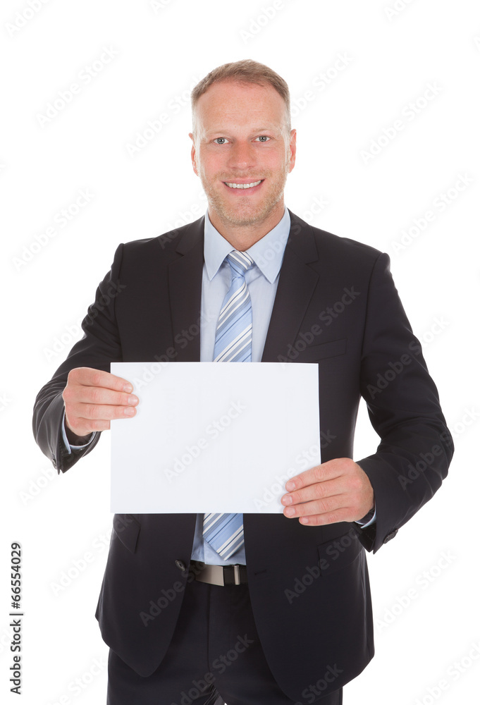 Confident Businessman Holding Wooden Plank Confident Businessman Holding Wooden Plank
