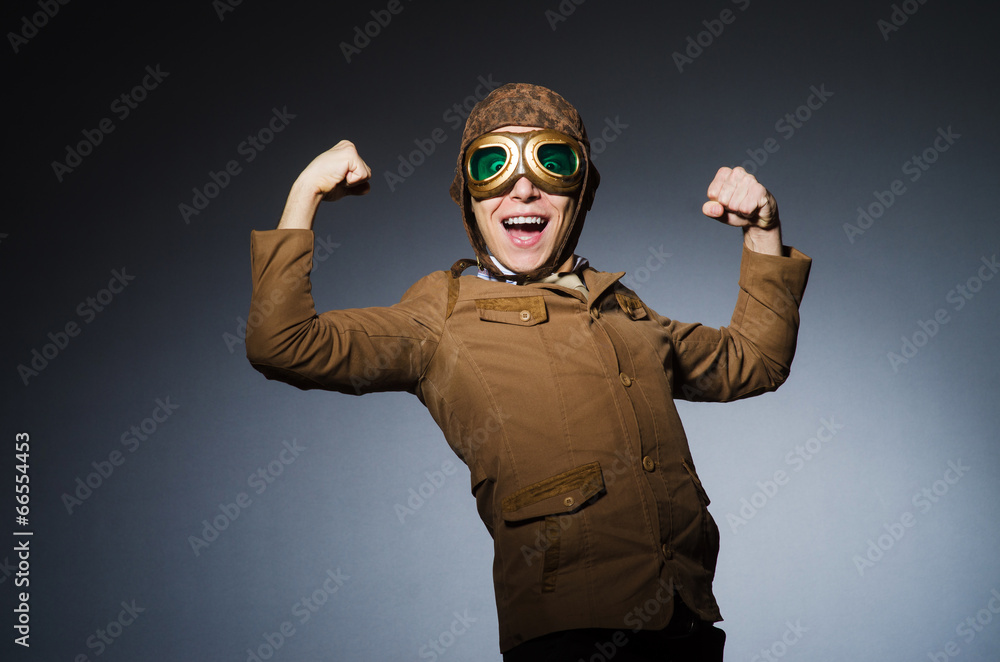 Funny pilot with goggles and helmet Funny pilot with goggles and helmet