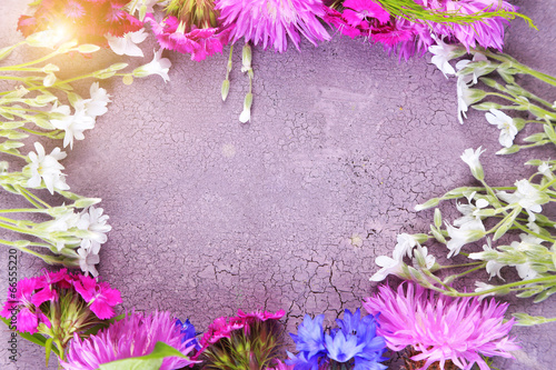 Fototapeta Naklejka Na Ścianę i Meble -  Bright wildflowers on color wooden background