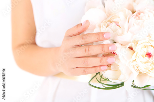 Bride holding wedding bouquet of white peonies  close-up