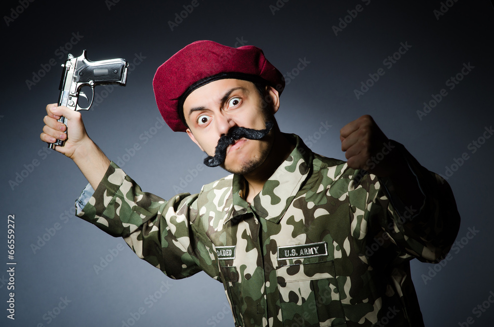 Funny soldier against the dark background Funny soldier against the dark background