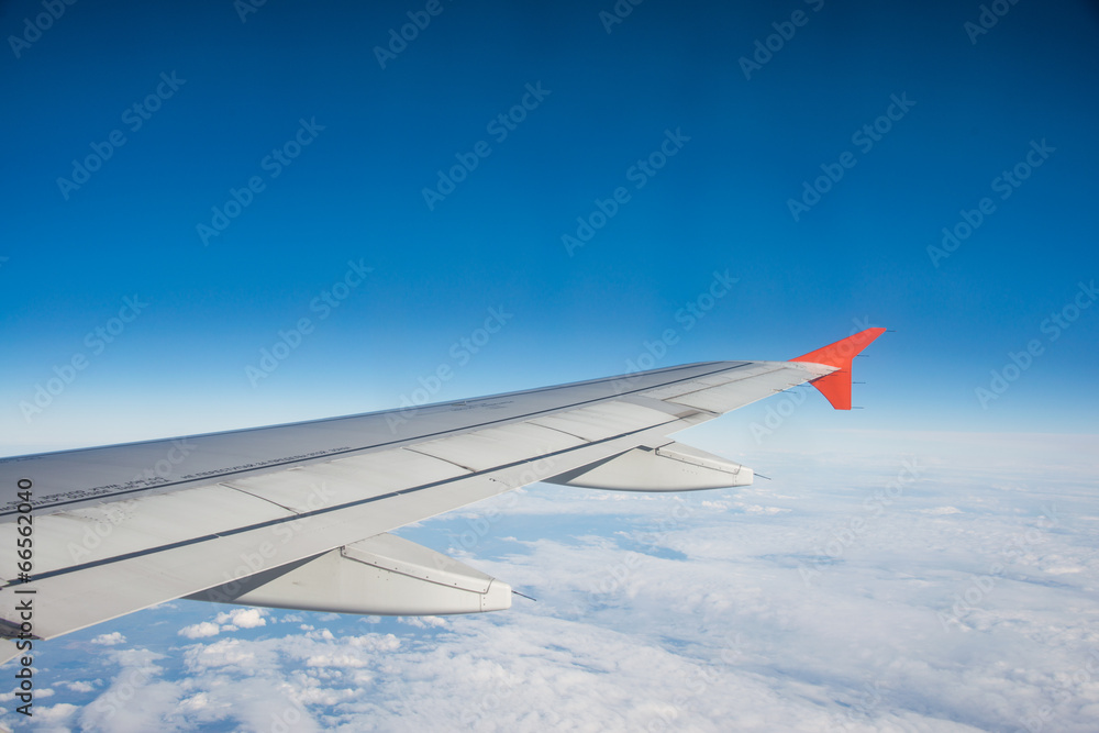 Airplane wing out of window Airplane wing out of window