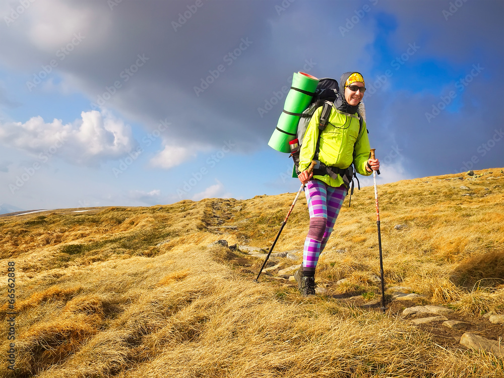 Tourist on mountain walkway. Sport and active life concept