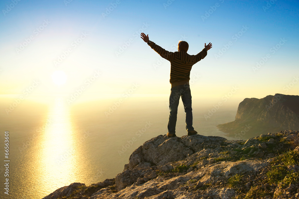 Champion on the mountain top. Sport and active life concept Champion on the mountain top. Sport and active life concept