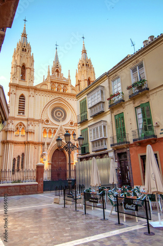 MALAGA - JUNE 12: City street view with cafeteria terraces and s