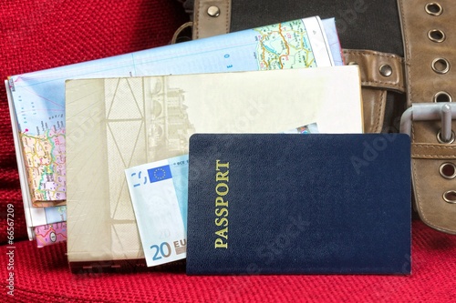 Close up of a traveling documents- passport, ticket, map
