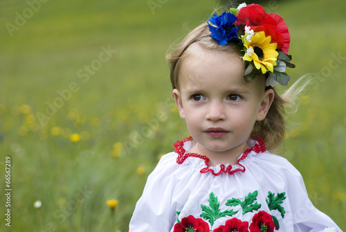 Little girl 2 years in Ukrainian traditional dress