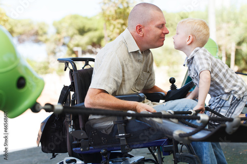 Dad play with son outdoor at park