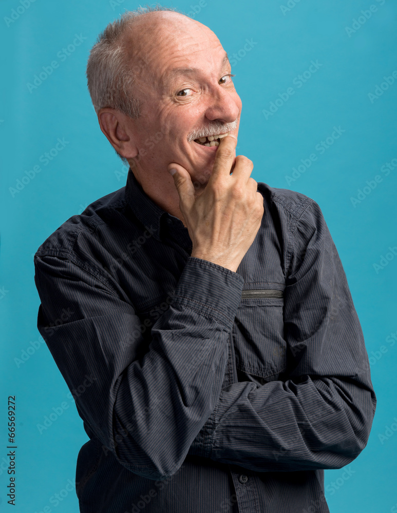 Portrait of handsome senior man with a sly expression Portrait of handsome senior man with a sly expression
