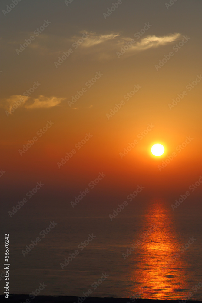 Deep orange color sunset on the beach