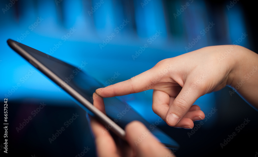 Finger pointing on tablet pc with empty space Finger pointing on tablet pc with empty space