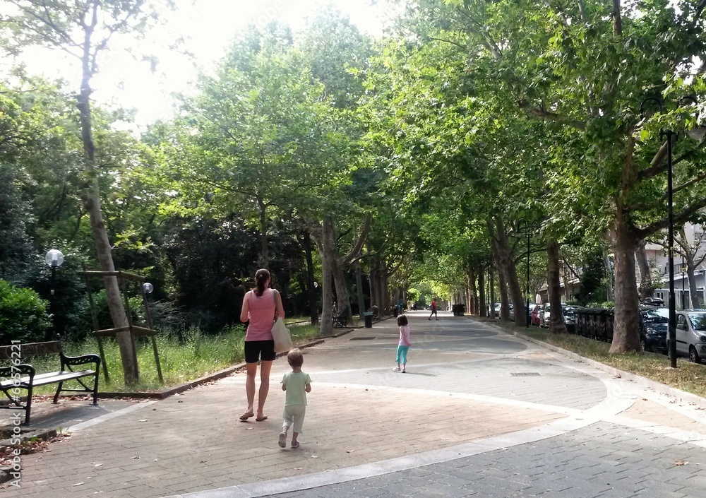 Fototapeta premium Family walking in a park