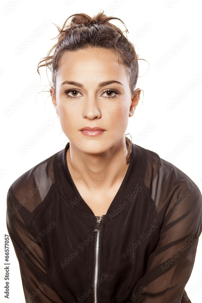 serious girl in blouse posing on white serious girl in blouse posing on white