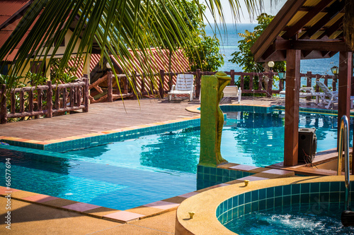 tropical resort swimming pool overlooking sea. Koh phangan