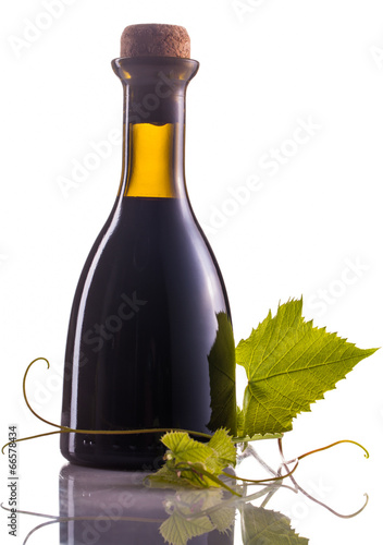winegar bottle isolated on white photo