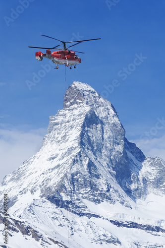 Helicopter flew over Matterhorn peak in Zermatt, Switzerland