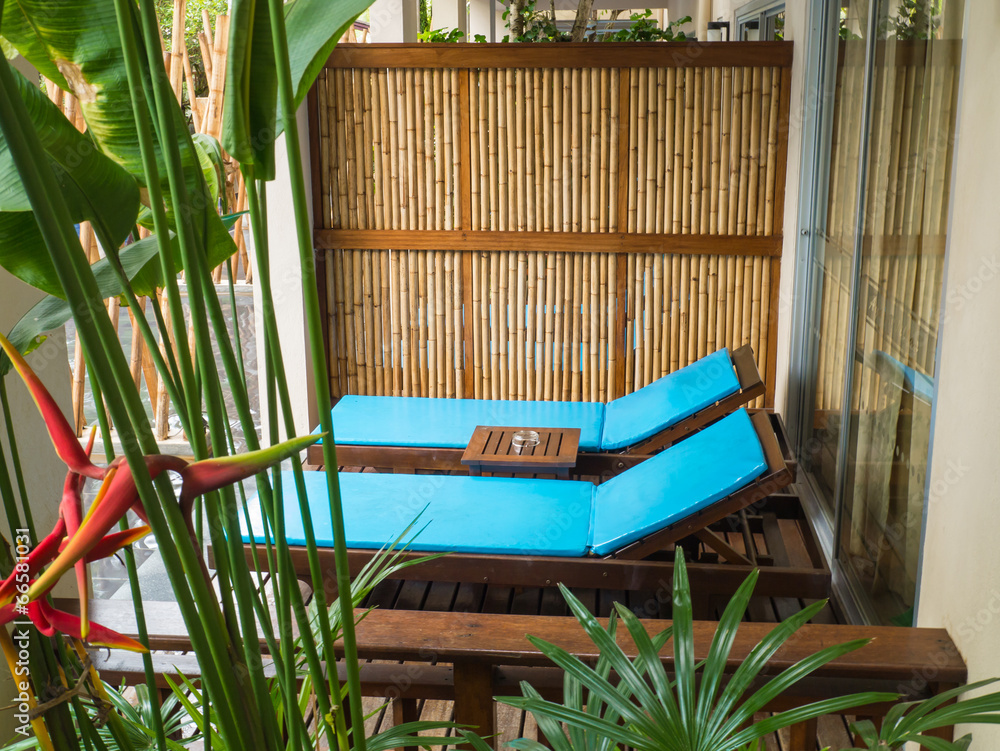 Beach chairs in tropical resort - obrazy, fototapety, plakaty 