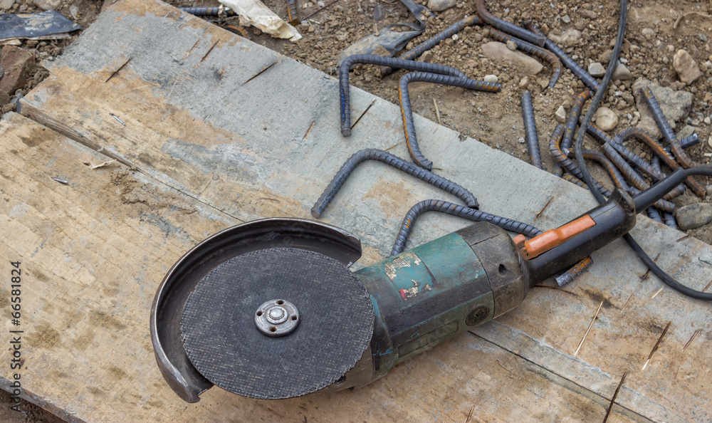 Angle grinder after cutting spacer for the rebar