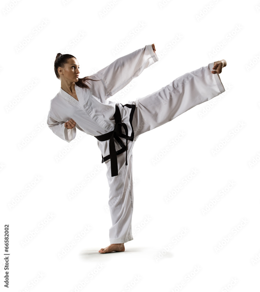 Karate woman in action isolated in white Karate woman in action isolated in white