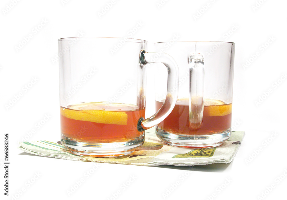 isolated cups of tea with a lemon