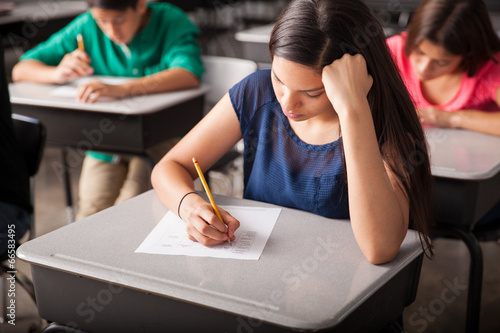 Fotografie Latin student taking a test in high school