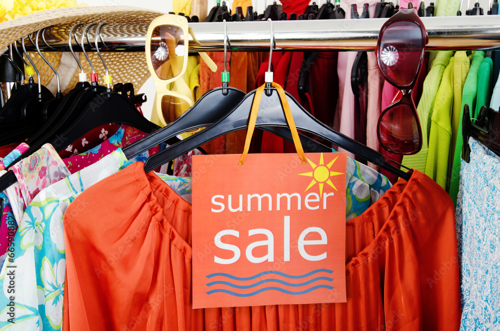 Close up on a big sale sign for summer clothes on clearance rack Stock  Photo