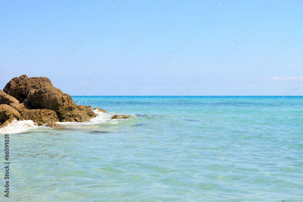 Color DSLR image of rocks in the blue water at South Beach, Miami, Florida Color DSLR image of rocks in the blue water at South Beach, Miami, Florida
