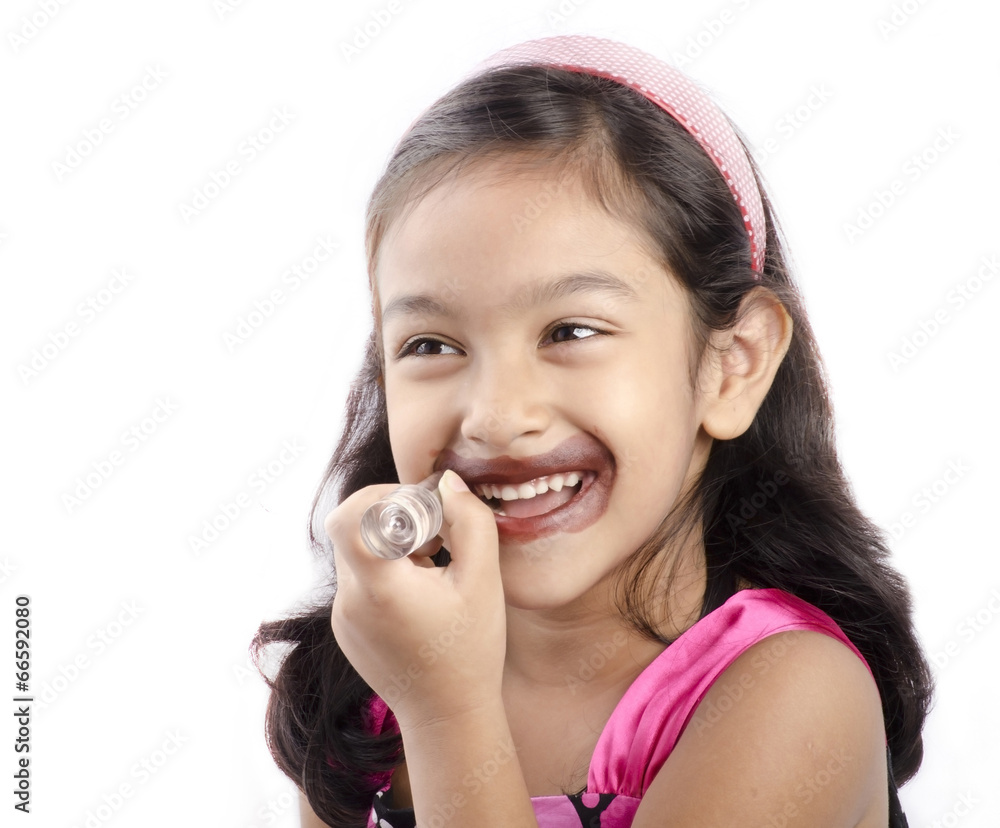 A little girl playing with a remote A little girl playing with a remote