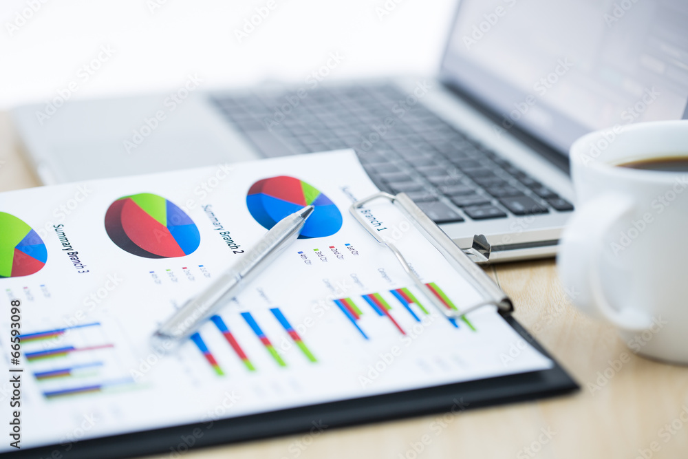 Businessman analyzing investment charts with laptop Businessman analyzing investment charts with laptop