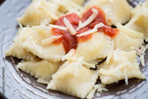 Close-up of italian ravioli with tomato sauce and cheese