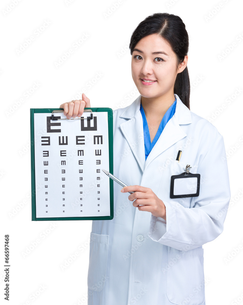 Doctor with pen point to eye chart Doctor with pen point to eye chart