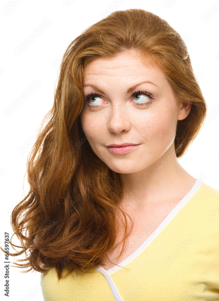Young happy woman is looking up and smile Young happy woman is looking up and smile