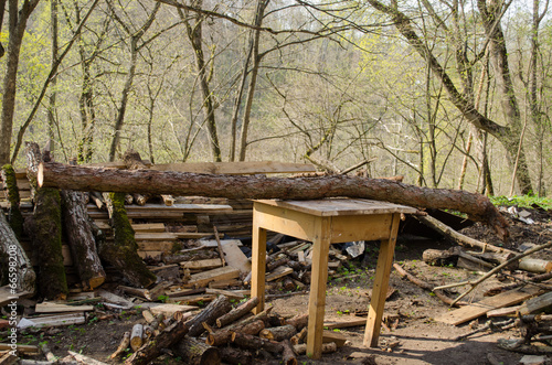 board logs piles and wooden table for cutting log