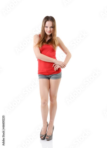 attractive happy teen girl in red t-shirt, full length portrait © Khorzhevska