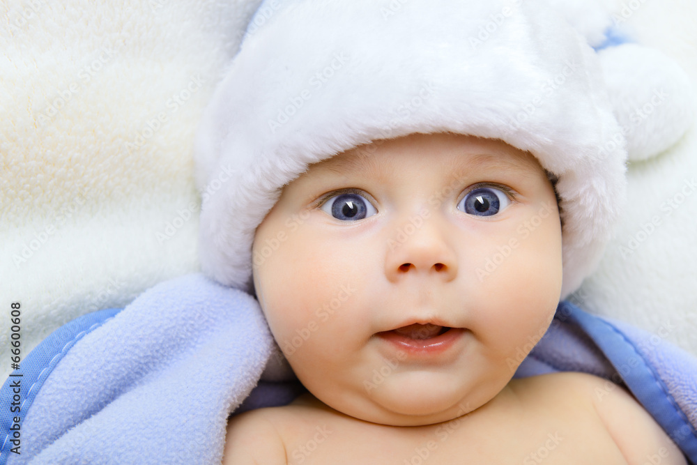 christmas cute baby boy, beautiful infant in Santa's hat and blu christmas cute baby boy, beautiful infant in Santa's hat and blu