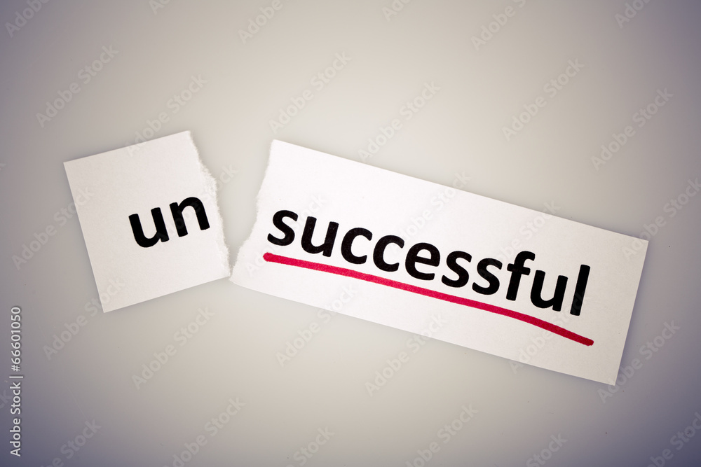 The word unsuccessful changed to successful on torn paper