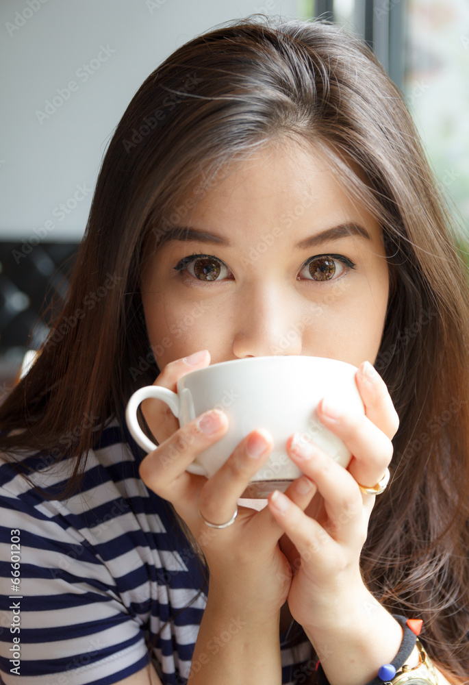 Close up portrait of woman drinking coffee Close up portrait of woman drinking coffee