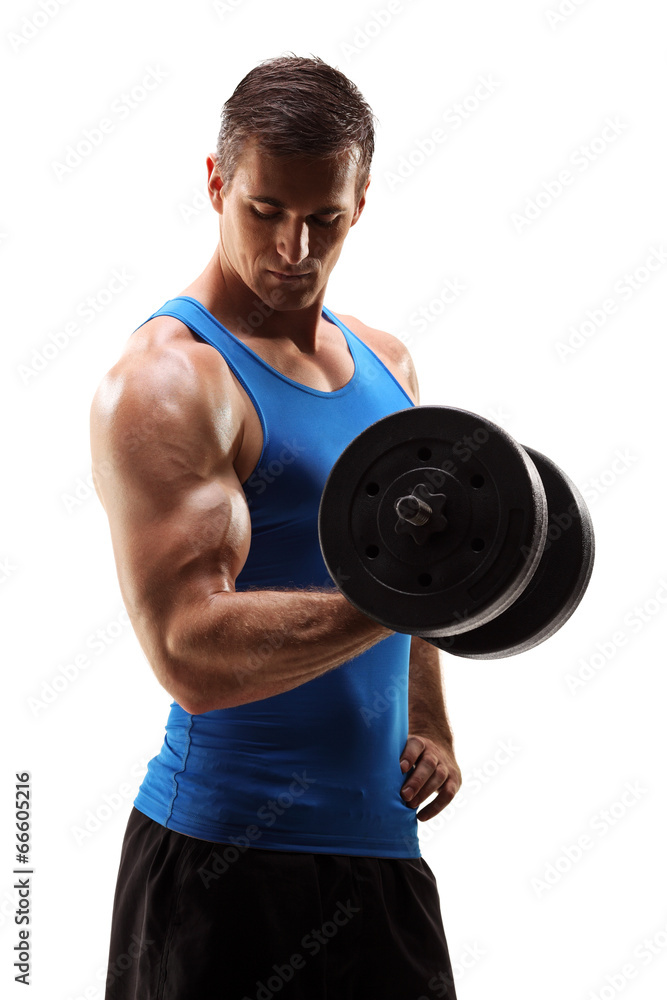 Studio shot of muscular young man lifting barbell Studio shot of muscular young man lifting barbell