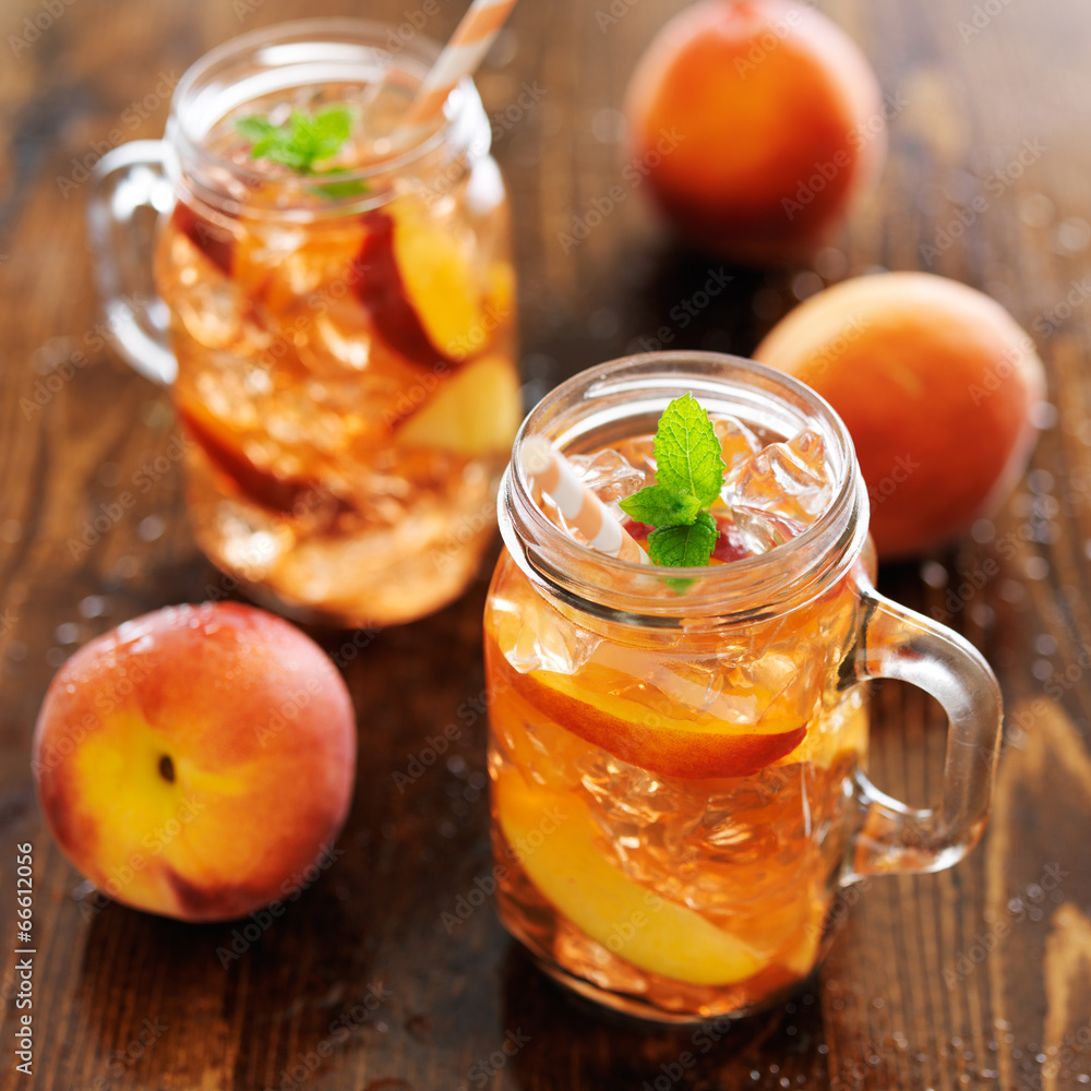jar of peach tea shot with selective focus jar of peach tea shot with selective focus