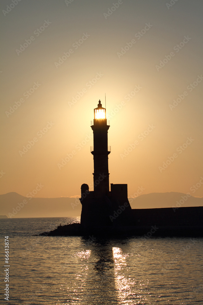 Lighthouse silhouette at sunset Chania Crete