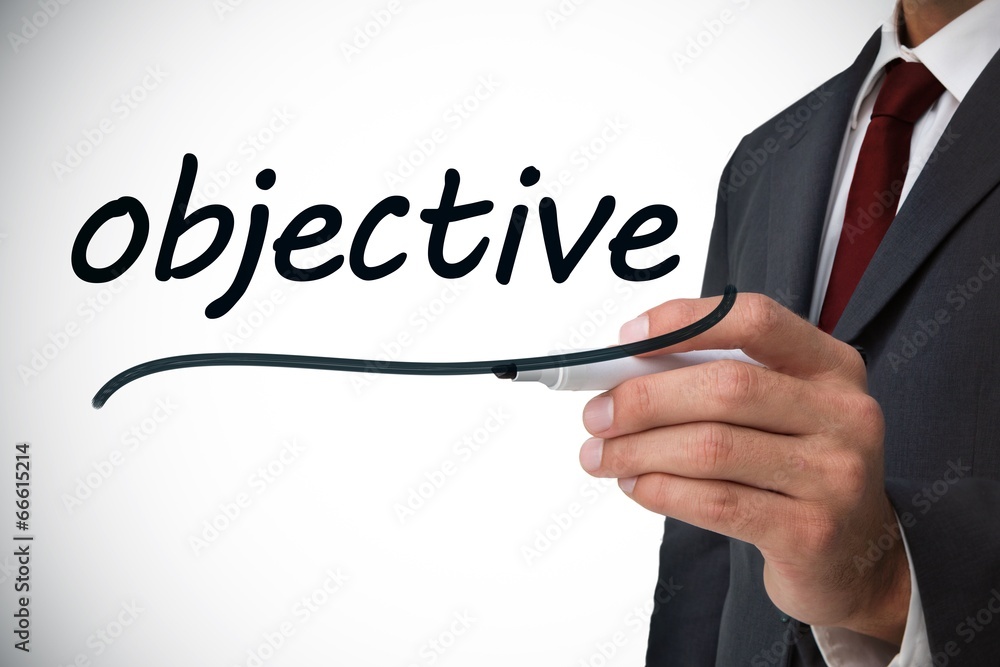 Businessman writing the word objective Businessman writing the word objective