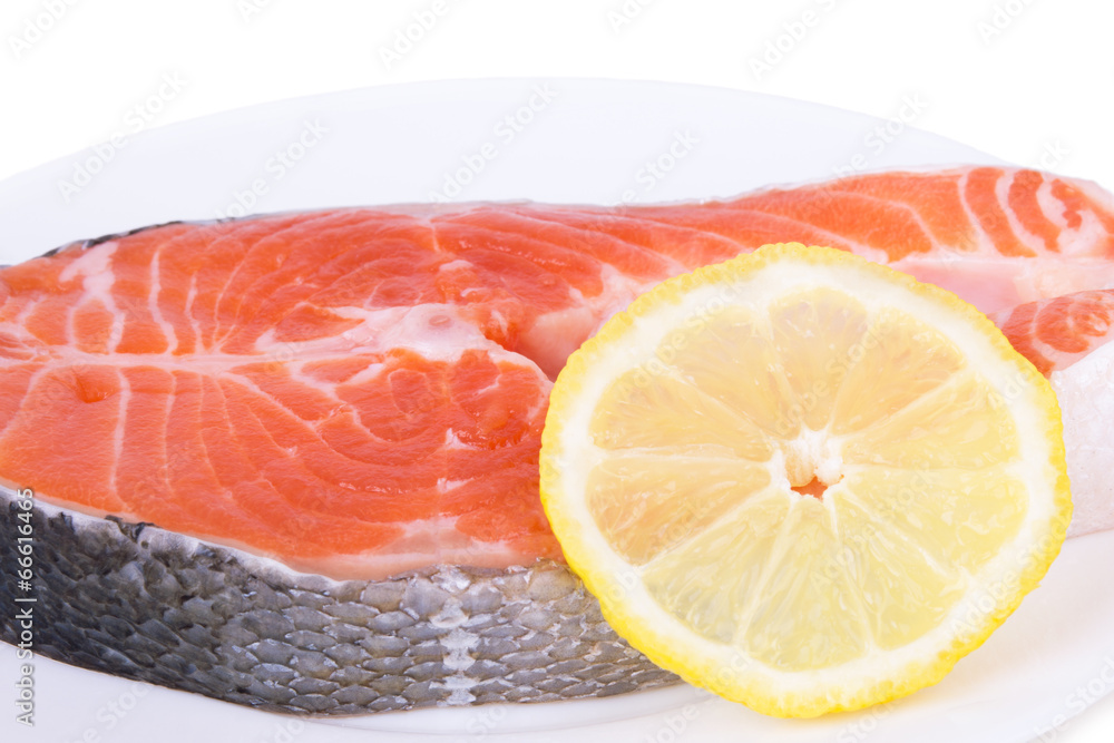 salmon with lemon on a plate salmon with lemon on a plate