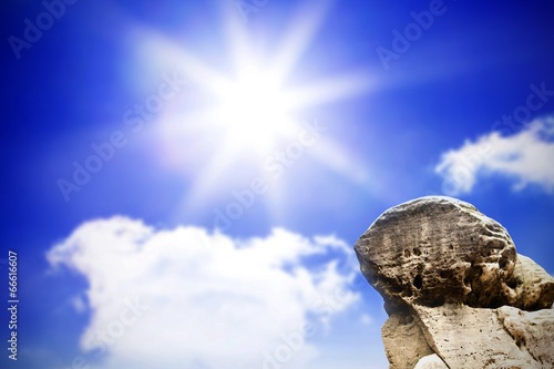 Large rock overlooking bright sky