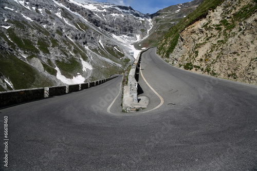 Serpentine road in the italian Alps leads to Stelvio Pass photo