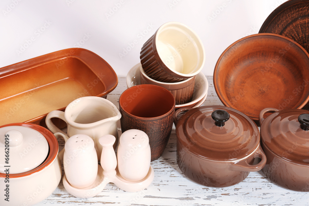 Different tableware on shelf, close up Different tableware on shelf, close up