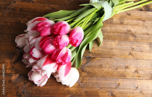 Fototapeta Naklejka Na Ścianę i Meble -  Beautiful tulips on color wooden background