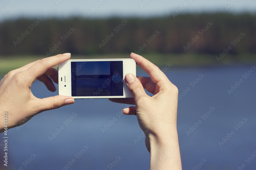 hands with smartphone take photos of scenery. hands with smartphone take photos of scenery.