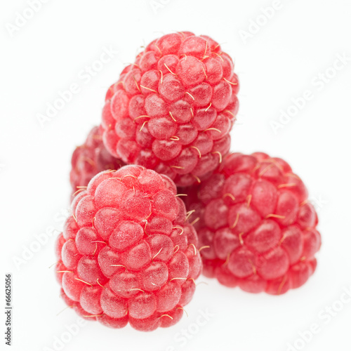 red raspberry lying in form of pyramid