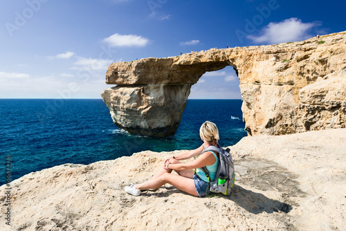 Girl looking on Azure Window on Gozo Island